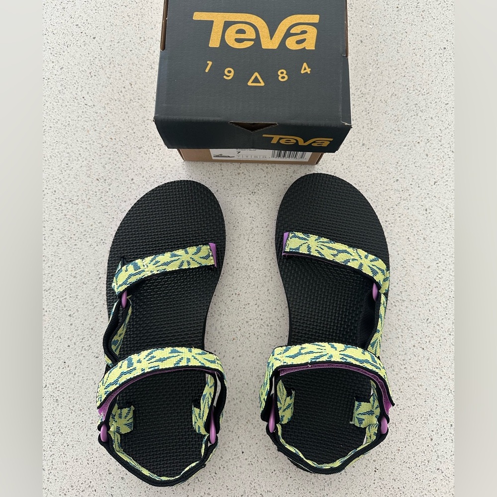 Teva Black Sandals w/ Green Leaf Design. Woman’s size 7. New in box.